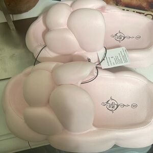 Slides, uniquely has the pop bubble look, feel similar to Crocs. Soft pink